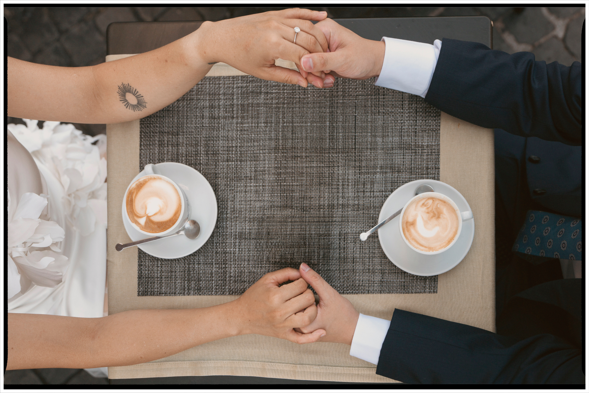 Nga and Đạt holding hands over morning coffee
